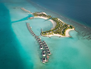 An aerial view of a resort with overwater bungalows connected by a dock, a beach area, and a small island with structures. - SO/ Maldives - FREE shared speadboat for min 3 nights stay until 20 Dec 2026 (Emboodhoo)