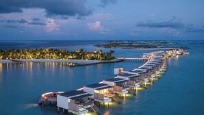 An overwater resort with multiple bungalow-style accommodations connected by walkways. - SO/ Maldives (Emboodhoo)