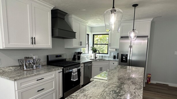 A modern kitchen with white cabinetry, a stainless steel refrigerator, a built-in oven, and a granite countertop. - 🐎 2 Miles to Flintfields, Fenced Yard pet friendly, FREE RENTAL Golf Cart (Williamsburg)