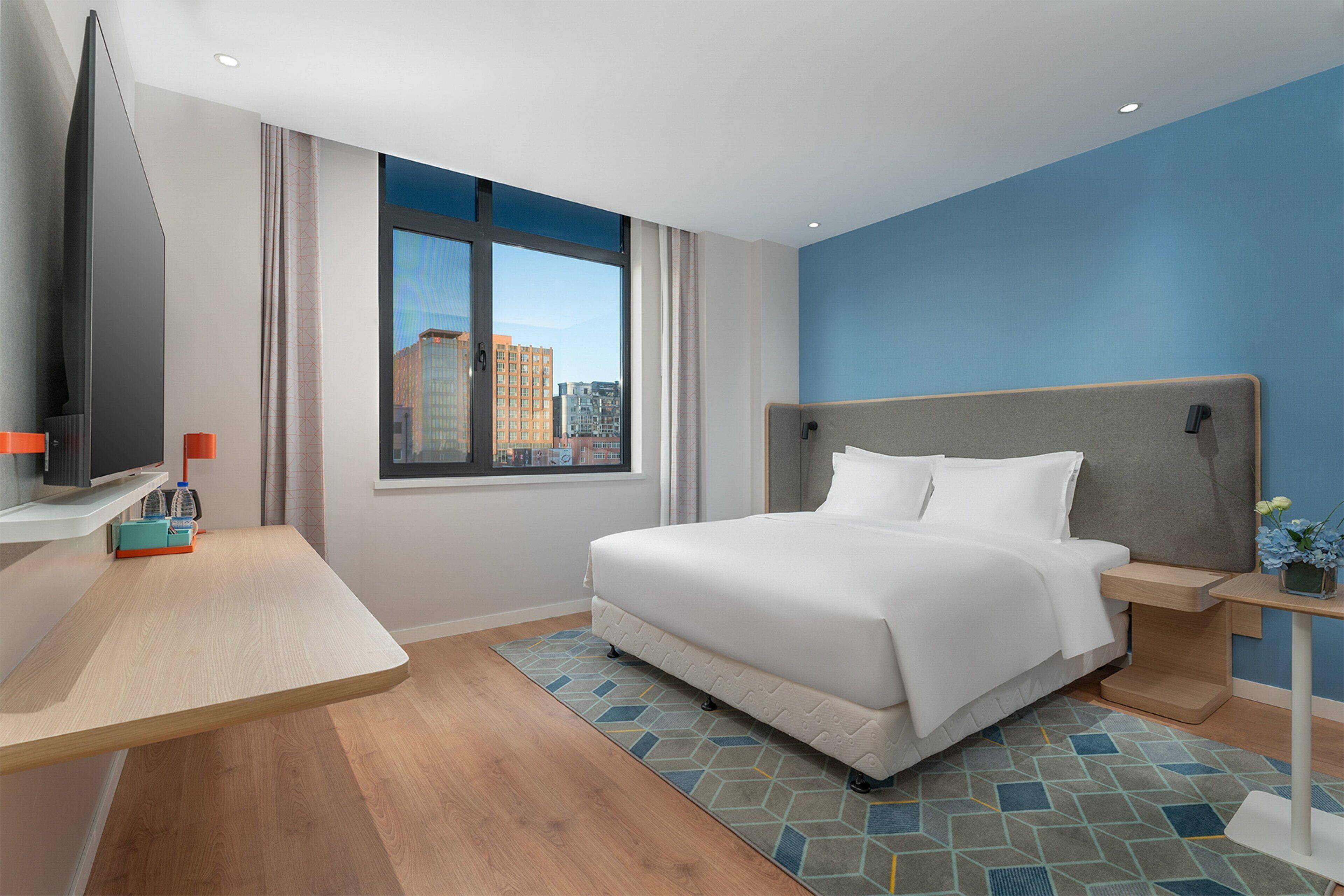 Premium bedding, down comforters, laptop workspace, blackout drapes