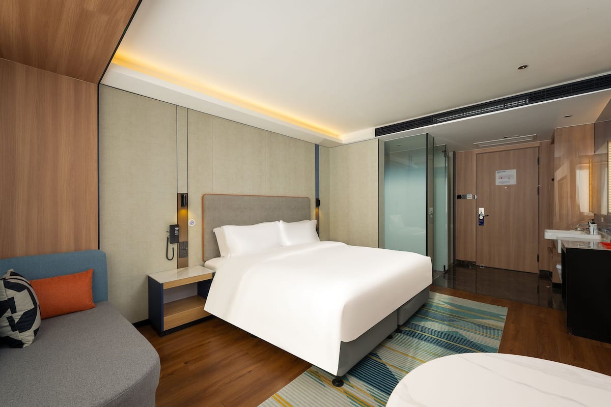Premium bedding, desk, laptop workspace, blackout curtains