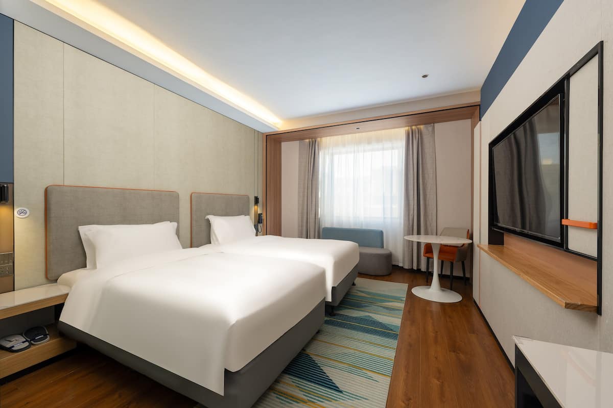 Premium bedding, desk, laptop workspace, blackout curtains