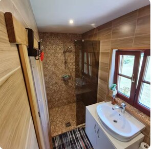 Shower, hair dryer, slippers, towels