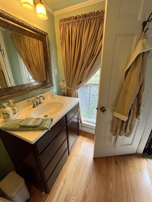 A bathroom with a sink, mirror, and window with curtains. - Happy Moo's Fink Family Farm, where cows & guests are free to enjoy our 50 acres (Versailles)