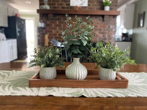 A wooden tray with three potted plants on a patterned rug. - Happy Moo's Fink Family Farm, where cows & guests are free to enjoy our 50 acres (Versailles)