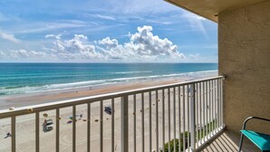 A balcony with a view of the beach and ocean. - Sunrise Seven Deluxe Oceanfront Condo (Daytona Beach)