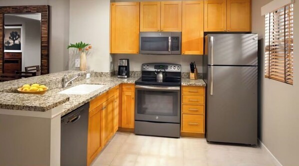 Enjoy cooking in this fully equipped kitchen with an oven, microwave, and dishwasher.