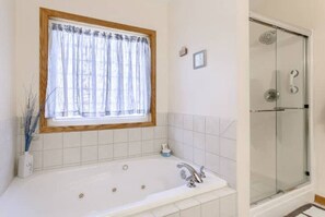 Jetted tub, hair dryer, towels, soap
