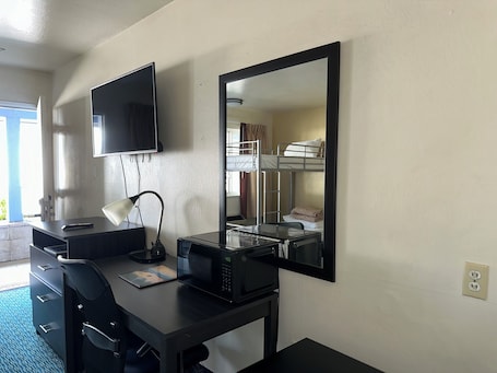 Family room with 1 Queen Bed and 1 Bunk Bed | Blackout drapes, iron/ironing board, free WiFi, bed sheets