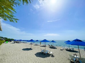 On the beach, sun-loungers, beach umbrellas