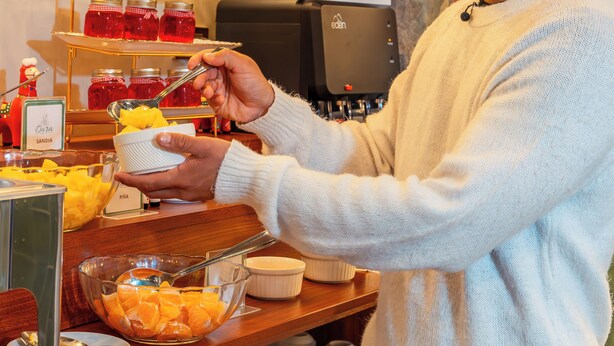 A buffet area with a variety of food items and a sign welcoming guests. - MONTREAL MAGDALENA HOTEL  (Lima)