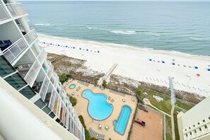 A hotel with a rooftop pool, beach access, and ocean views. - Palacio 1706 | Oceanfront, Resort Amenities | My Beach Getaways (Pensacola)