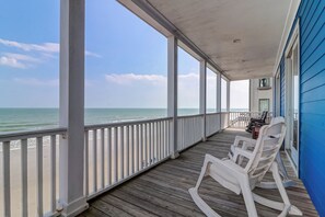 A wooden deck with white railings overlooking a beach. - Sweeping Views, Oceanfront Porches, Private Beach Access, Close to Lighthouse - Double Stack (Folly Beach)