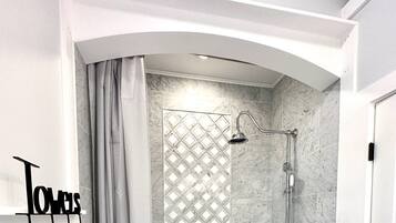 Bathtub, hair dryer, towels