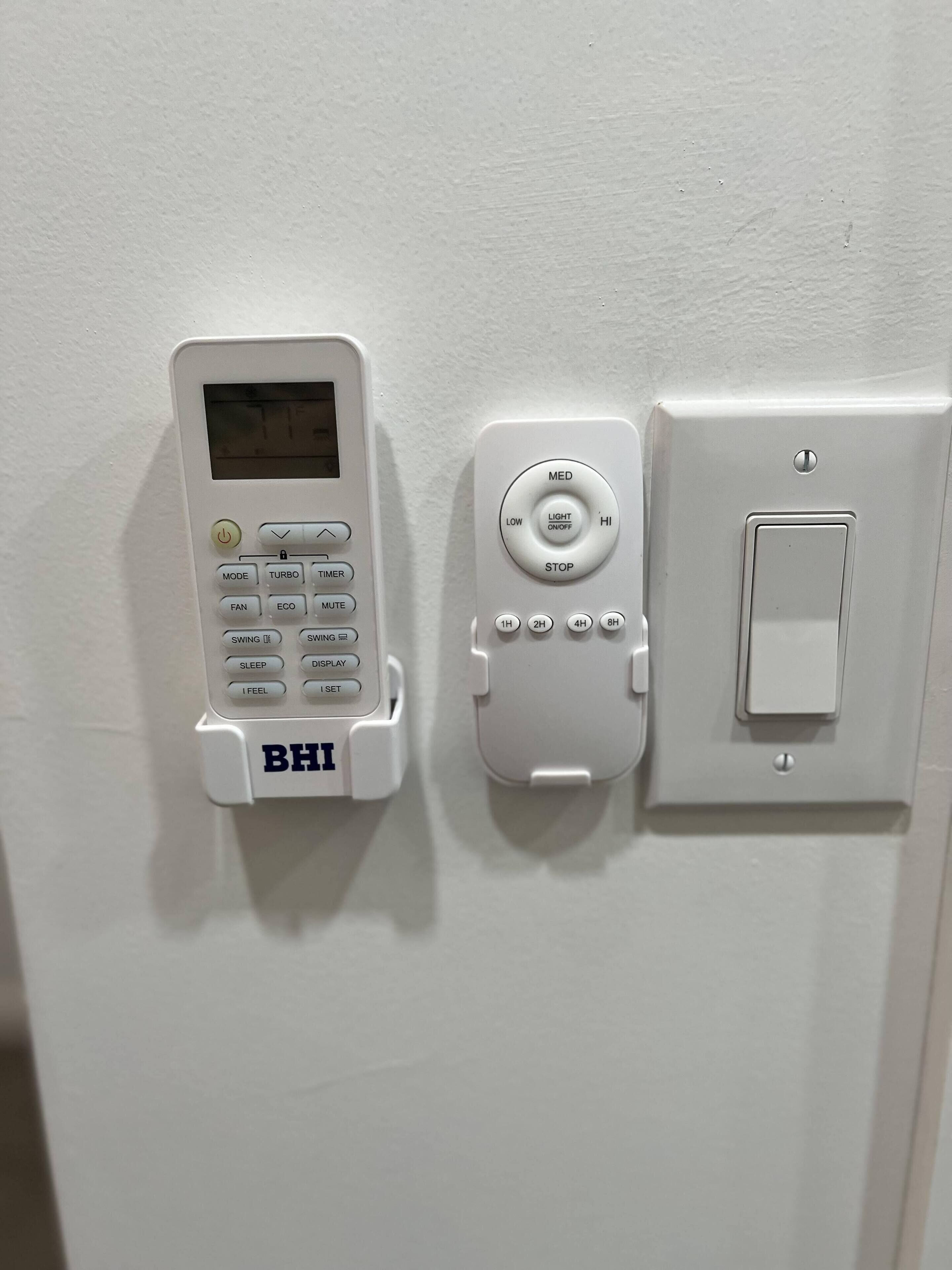 A control panel with a BHI brand device, a timer, and a light switch.