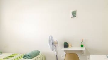 Economy Double or Twin Room | Desk, laptop workspace, blackout drapes, iron/ironing board