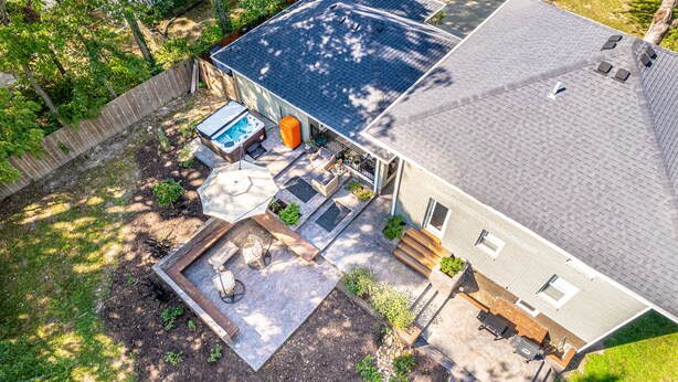 A house with a covered patio, outdoor seating, and a hot tub. - HOTTUB! private outdoor spaces-WALK downtown and MU. PETS OK Top Notch finishes (Columbia)