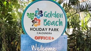 A sign for Golden Beach Holiday Park in Caloundra, including a map and site directory. - Golden Beach Holiday Park (Golden Beach)