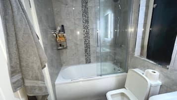 Bathtub, hair dryer, towels