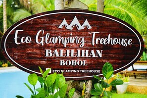 A wooden sign for Eco Glamping Treehouse in Balilihan, Bohol. - ECO-TREEHOUSE GLAMPING SERVICES (Balilihan)