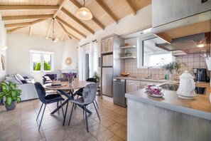 Fridge, stovetop, dishwasher, coffee/tea maker