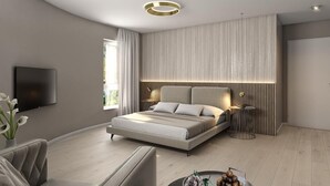 Ein modernes Schlafzimmer mit einem großen Bett, einem Fernseher und einer runden Deckenleuchte.