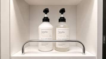 Shower, designer toiletries, hair dryer, slippers