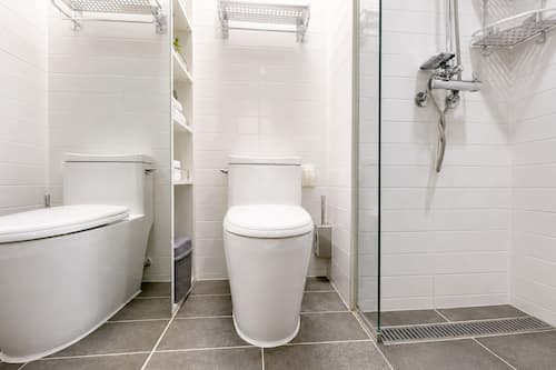 Shower, designer toiletries, hair dryer, slippers