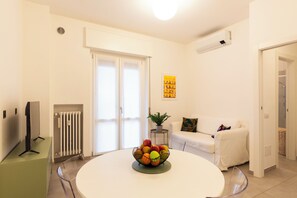 Panoramic Condo | Living area | 32-inch flat-screen TV with digital channels