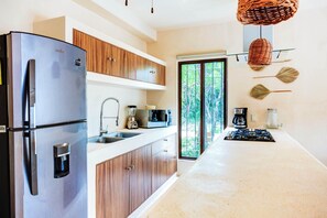 Fridge, microwave, stovetop, coffee/tea maker