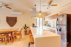 Fridge, microwave, stovetop, coffee/tea maker