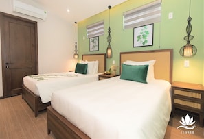 Superior Triple Room | Premium bedding, minibar, in-room safe, desk - Flower Beachstay & Coffee (Da Nang)