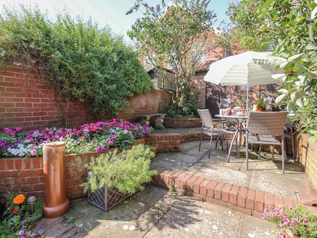 Restaurante al aire libre. Green Gate Cottage