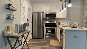Coffee/tea maker, fridge, microwave, oven