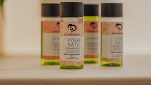 Three bottles of Aloe Vera Naxos Foam Bath on a wooden shelf. - Golden Bird's (Naxos)