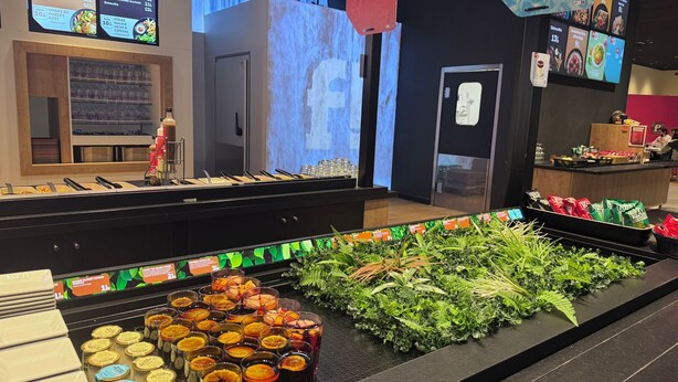 A buffet area with various food options, a refrigerated section, and a display of fresh herbs. - 4 bedroom house with garden near Lille  (Tourcoing)