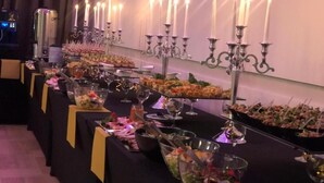 A buffet setup with various food items and candles. - Hotel Hutnik (Stalowa Wola)