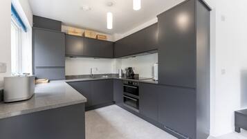 Coffee/tea maker, fridge, microwave, oven