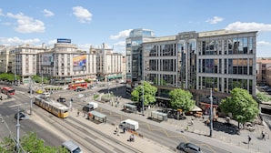 A city street with tram lines, buildings, and a clear sky. - Astoria Boutique Suites - by BQA (Budapest)
