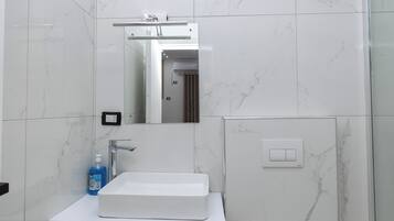 Shower, bidet, towels, soap