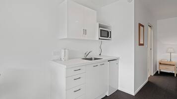 Fridge, microwave, toaster, cookware/dishes/utensils