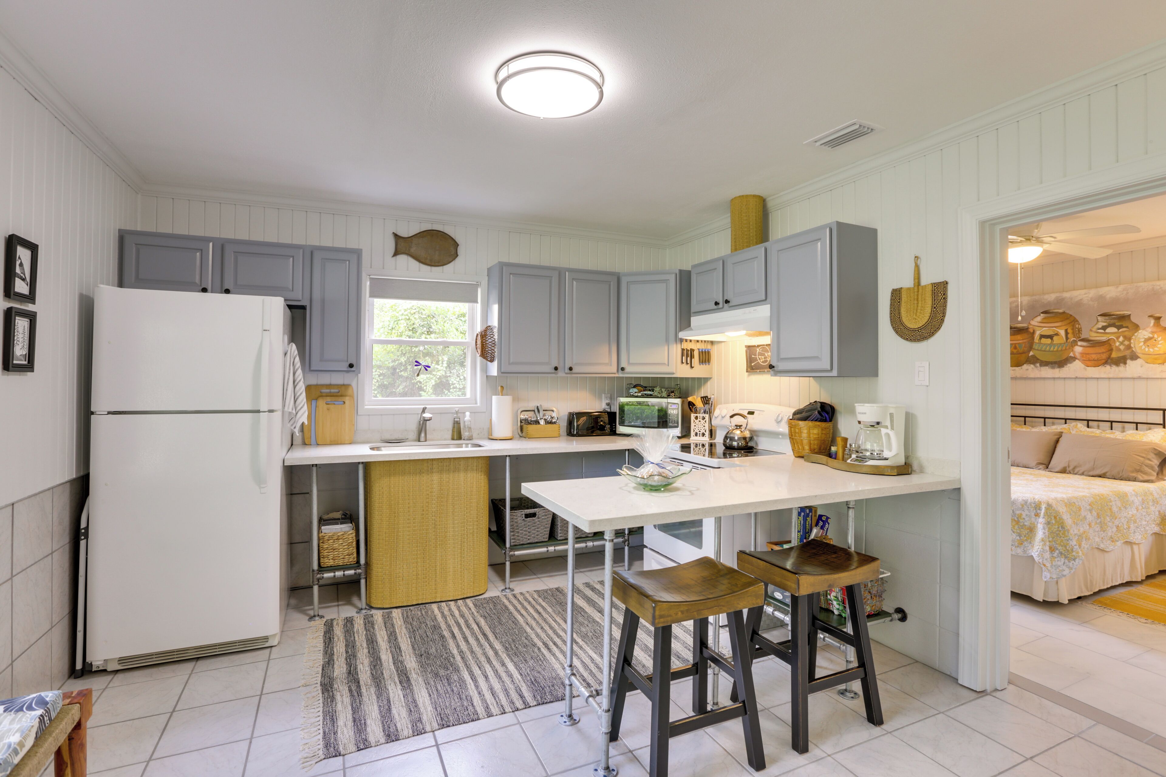 Fridge, microwave, stovetop, coffee/tea maker