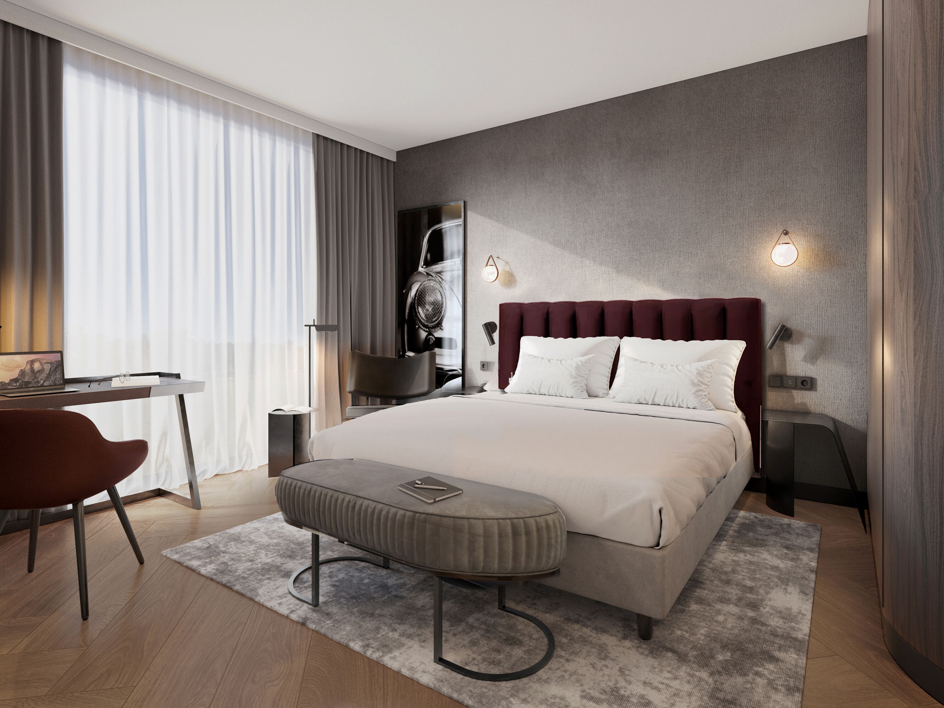 Ein modernes Hotelzimmer mit einem großen Bett, einem Schreibtisch und einem Sessel.