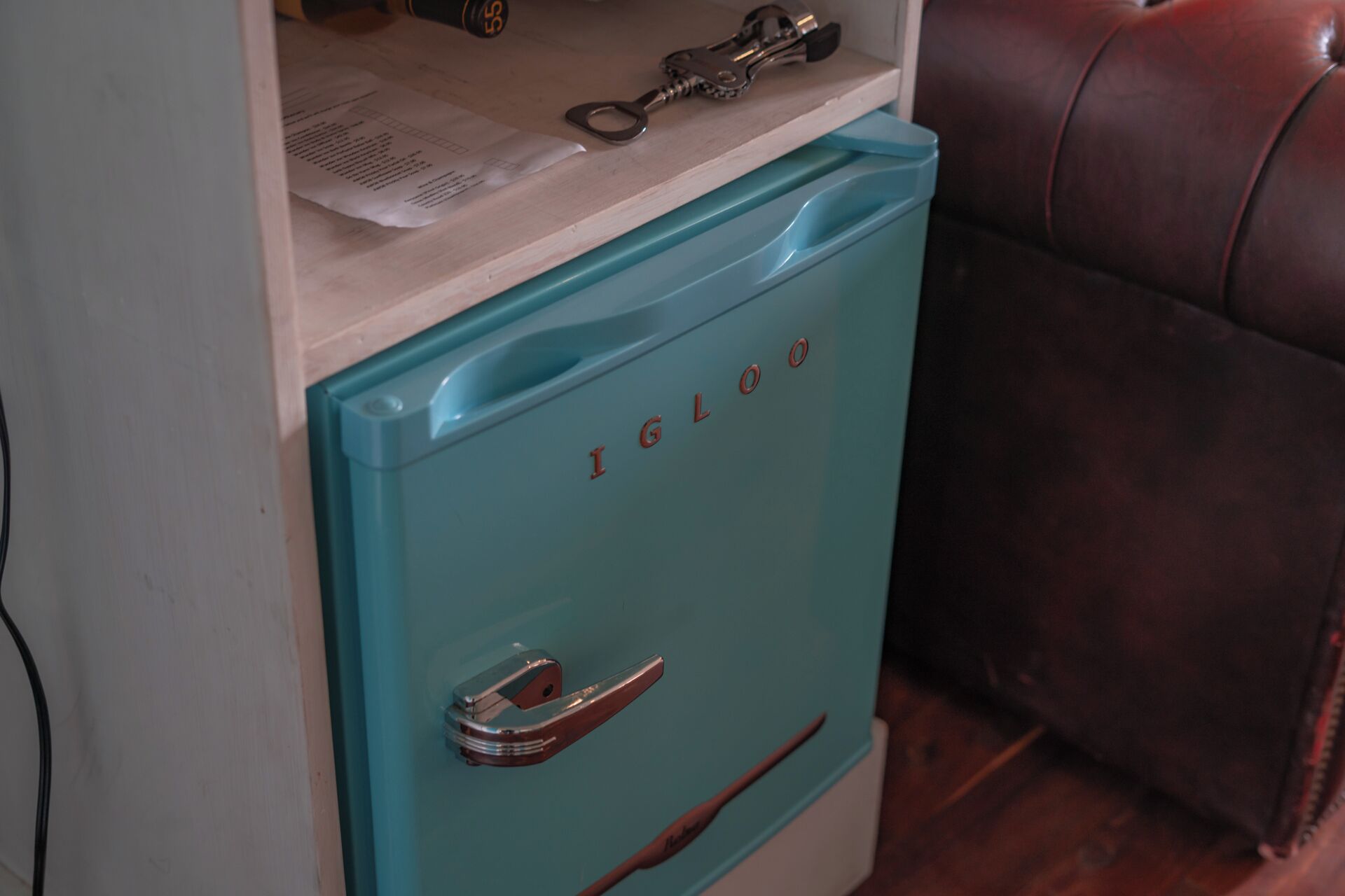 A teal-colored storage unit with the brand name 'IGLOO' on the front.