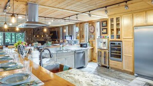 A spacious kitchen with wooden cabinets, a large island, and modern appliances. - Game Room, Mtn Views! Unit 1 Mi to Heavenly Resort (Stateline)