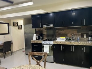 Fridge, microwave, stovetop, coffee/tea maker