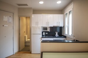 Fridge, microwave, electric kettle, cookware/dishes/utensils
