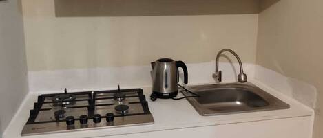 Fridge, microwave, electric kettle, cookware/dishes/utensils