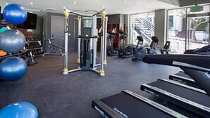 A gym with exercise equipment, treadmills, and exercise balls. - Westwood Living - Gorgeous Modern One Bedroom Available For Rent, Close to UCLA (Los Angeles)