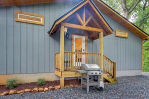 A wooden cabin with a porch, a grill, and a small deck. - Blue Ridge Mountainside Cottage w/ Fire Pit! (Epworth)